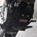 Black B&B bash plate protecting the underside of an off-road motorcycle
