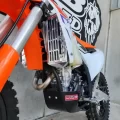 Off-road dirt bike fitted with B&B radiator guard and bash plate