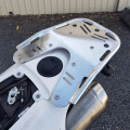 Polished B&B rear carry rack fitted to a Husqvarna 701 motorcycle