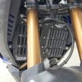 Black World Raid radiator guard for adventure motorcycle protection