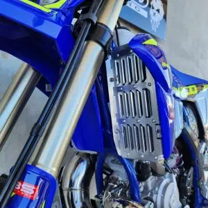 B&B Off Road radiator guard fitted to a blue off-road motorcycle